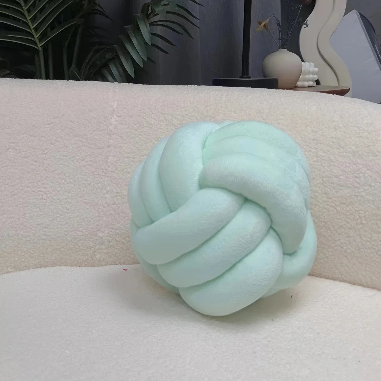 Handwoven knotted ball pillow