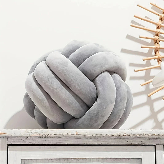 Handwoven knotted ball pillow